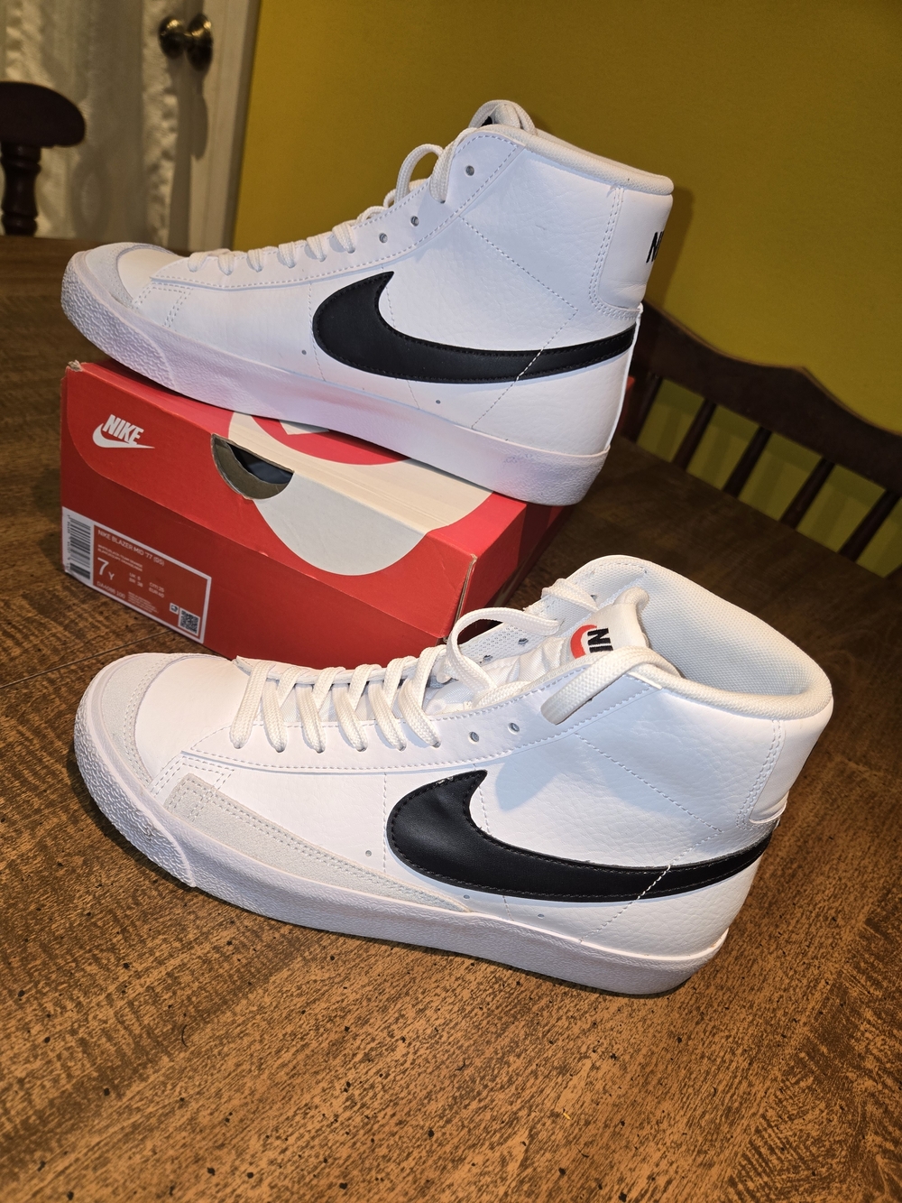 Nike White High-Top Sneakers with Black Swoosh